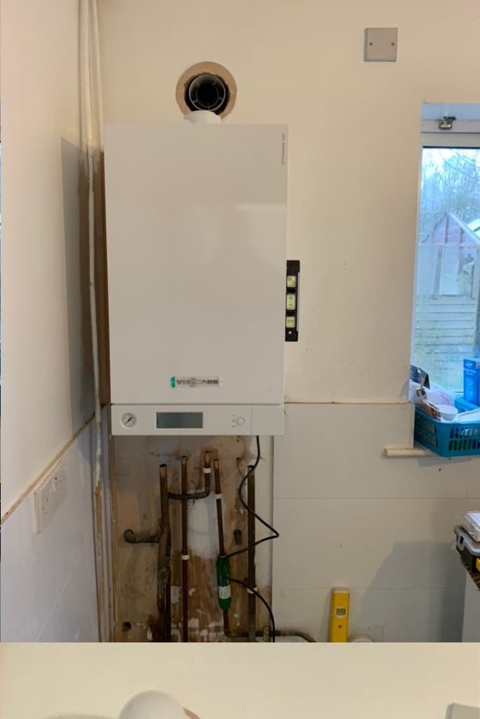 Wall prepared for new boiler installation with pipework ready — The Wetherby Plumber